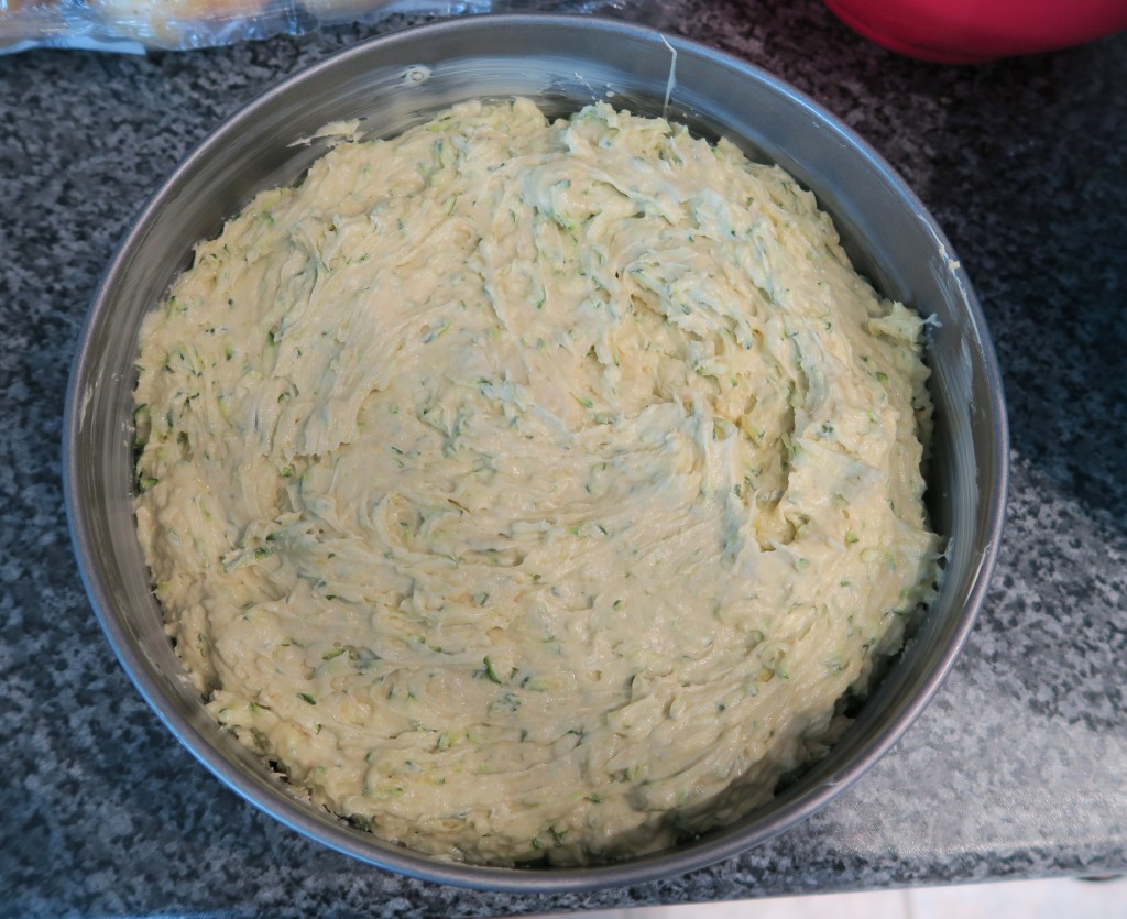 Courgette cake batter in a tin