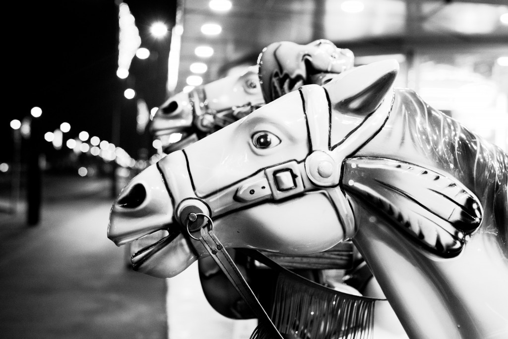 Black and white photograph of fairground horses
