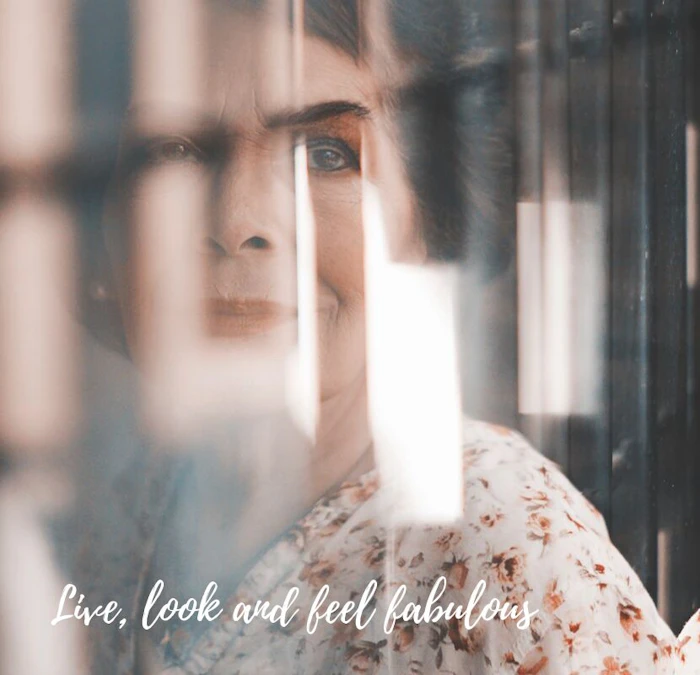 women looking out of the window with the platinum magazine quote